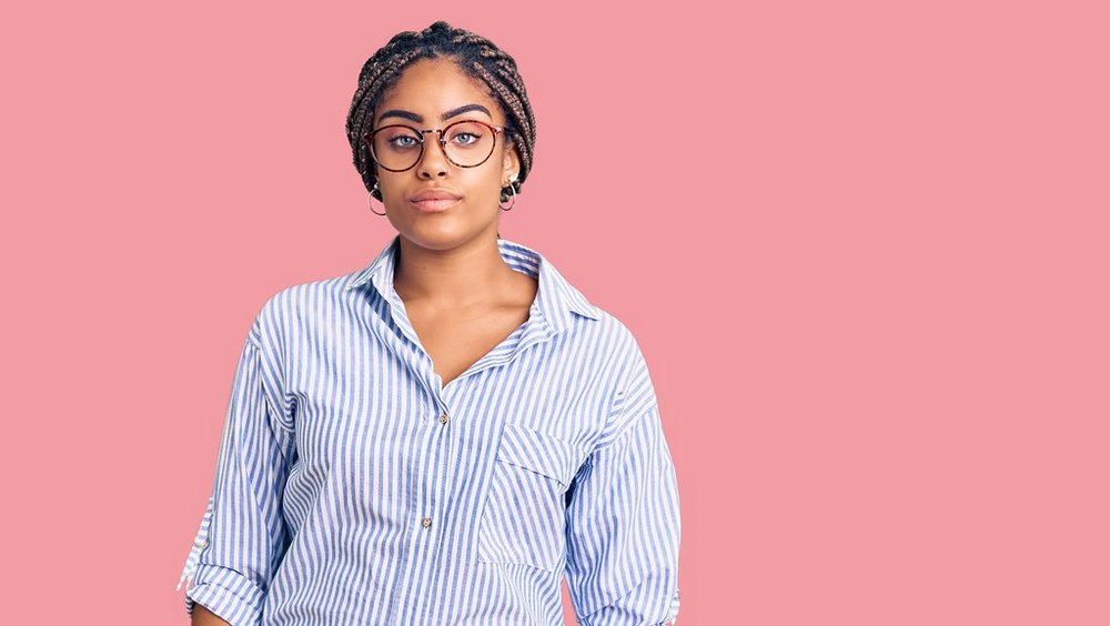 Young african american woman with braids wearing casual clothes a decorative element depicting a young African American woman wearing glasses
